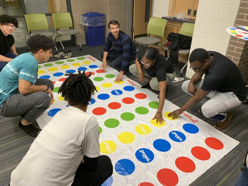students playing twister in Lions Gate lounge