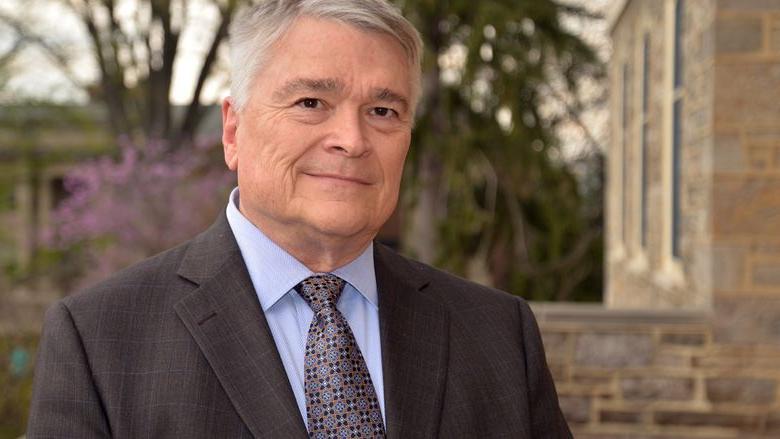 Portrait of Penn State President Eric Barron in front of Old Main on April 22, 2016.